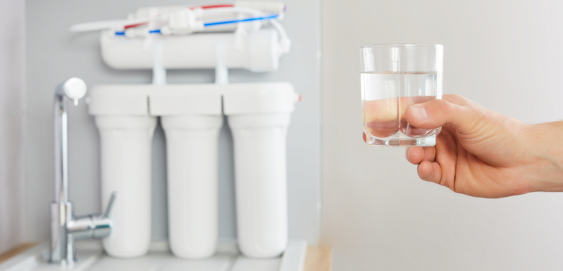 Salt-free water conditioner system installed in a home kitchen as an alternative to water softeners