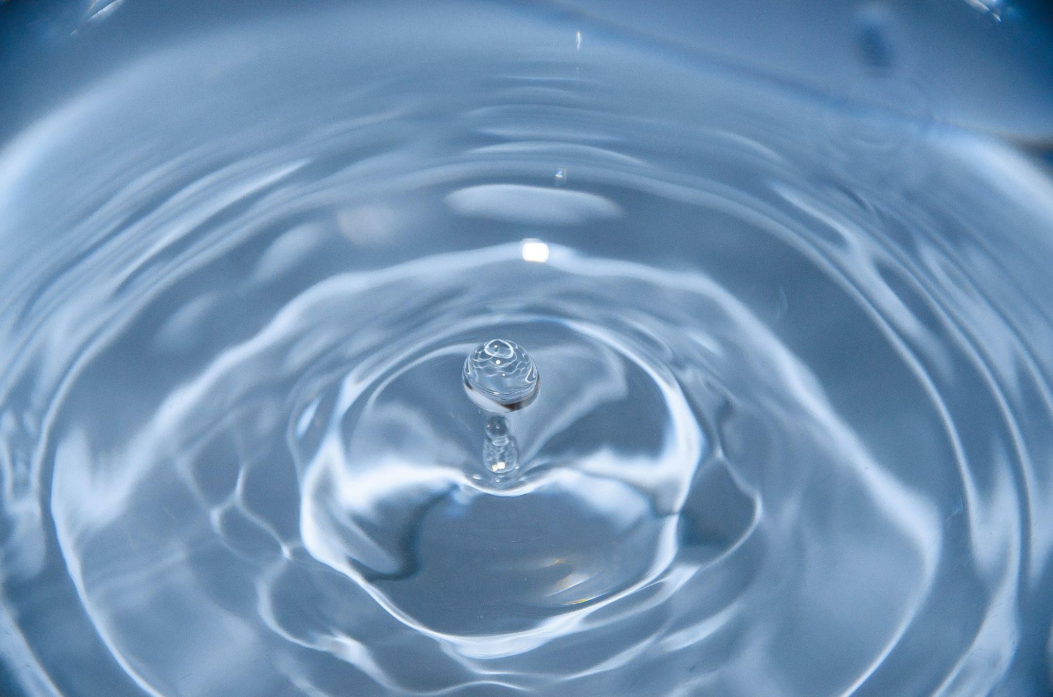 Macro shot of a water droplet splash, symbolizing the purity and clarity of reverse osmosis or filtered water.