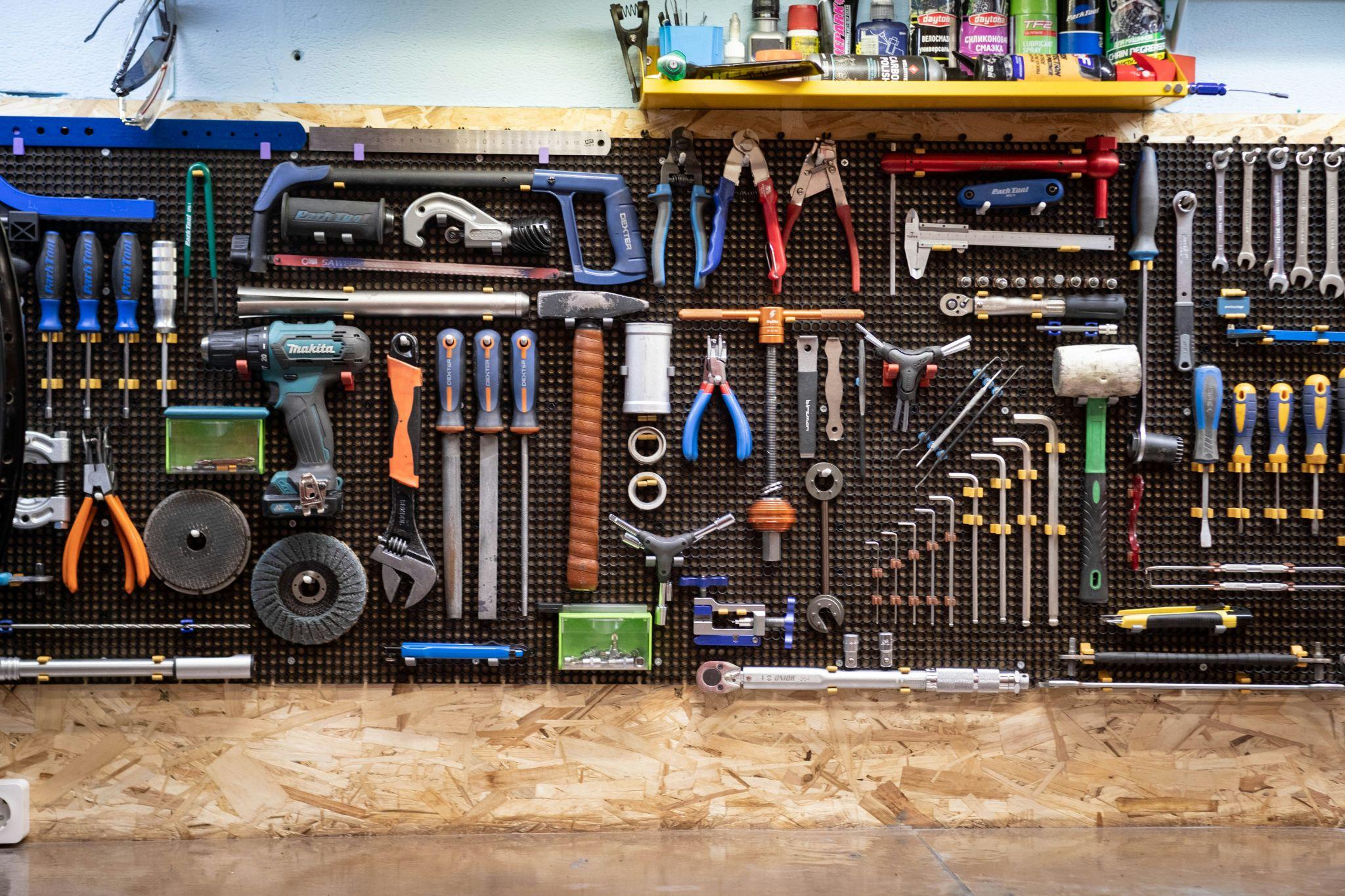 Organized wall of tools commonly used for installing and maintaining water softeners and demineralization systems.