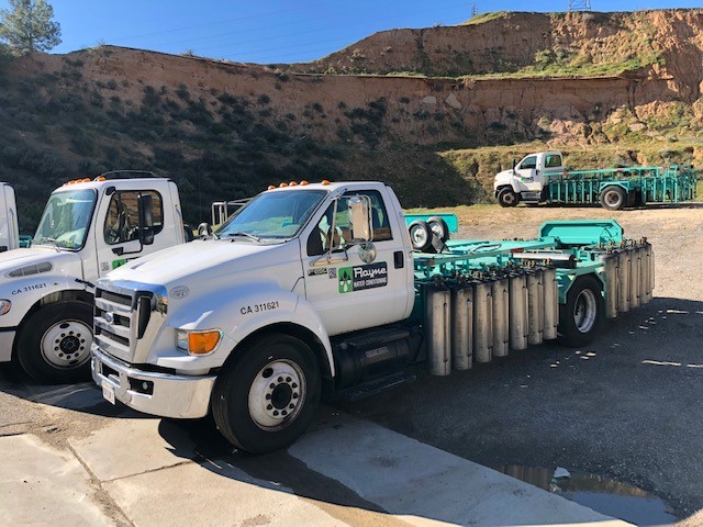 Rayne Water truck loaded with portable exchange tanks for Santa Clarita service